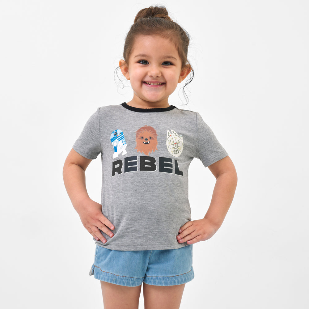 Child wearing a Rebel graphic tee and coordinating Play bottoms