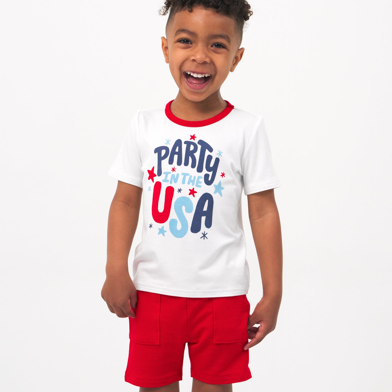 Child wearing a Party in the USA graphic tee and coordinating Play shorts