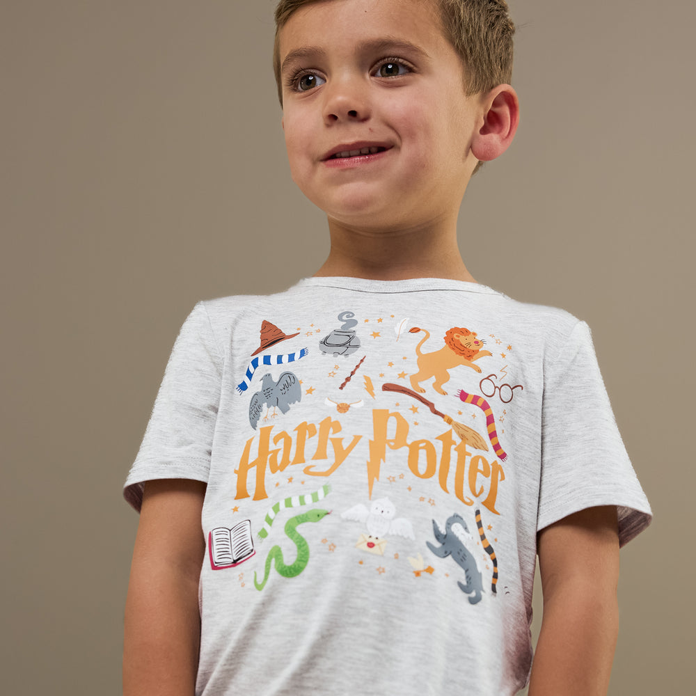 Close up image of a child wearing a Harry Potter Graphic Tee