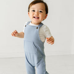 Child wearing a Fog overall and coordinating Play bodysuit