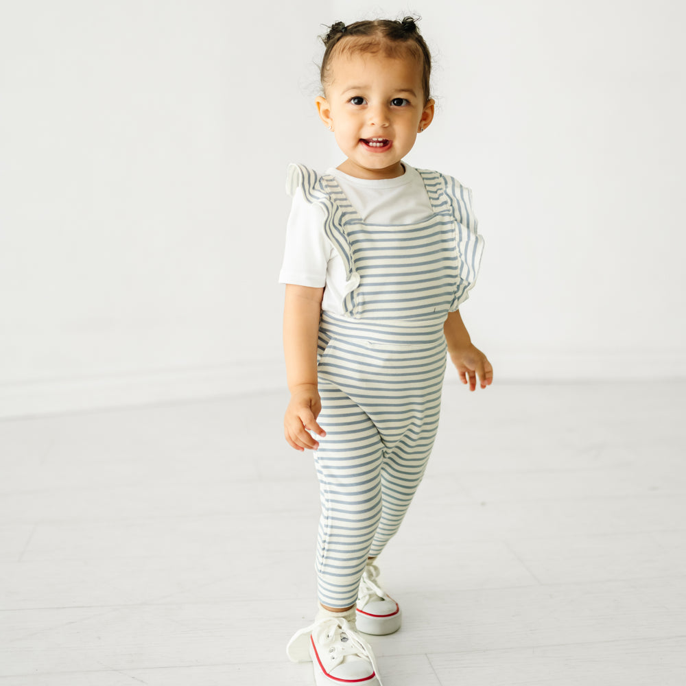 Child wearing Fog Stripes ruffle overall and coordinating Play top