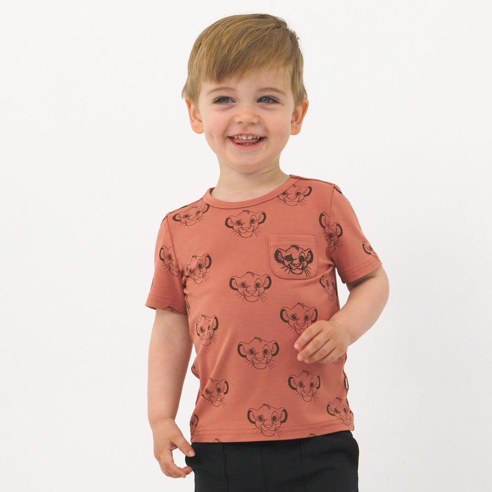 Child wearing a Sweet Simba embroidered pocket tee and coordinating Play shorts