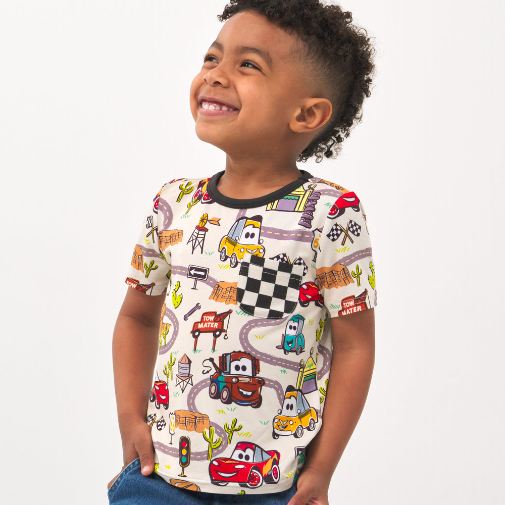Close up image of a child wearing a Radiator Springs pocket tee
