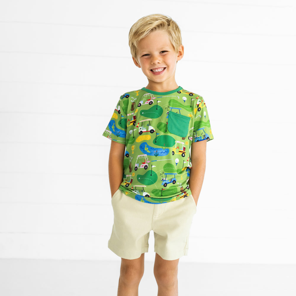 Image of a child wearing a Fairway Fun Pocket Tee and Light Khaki Chino Shorts