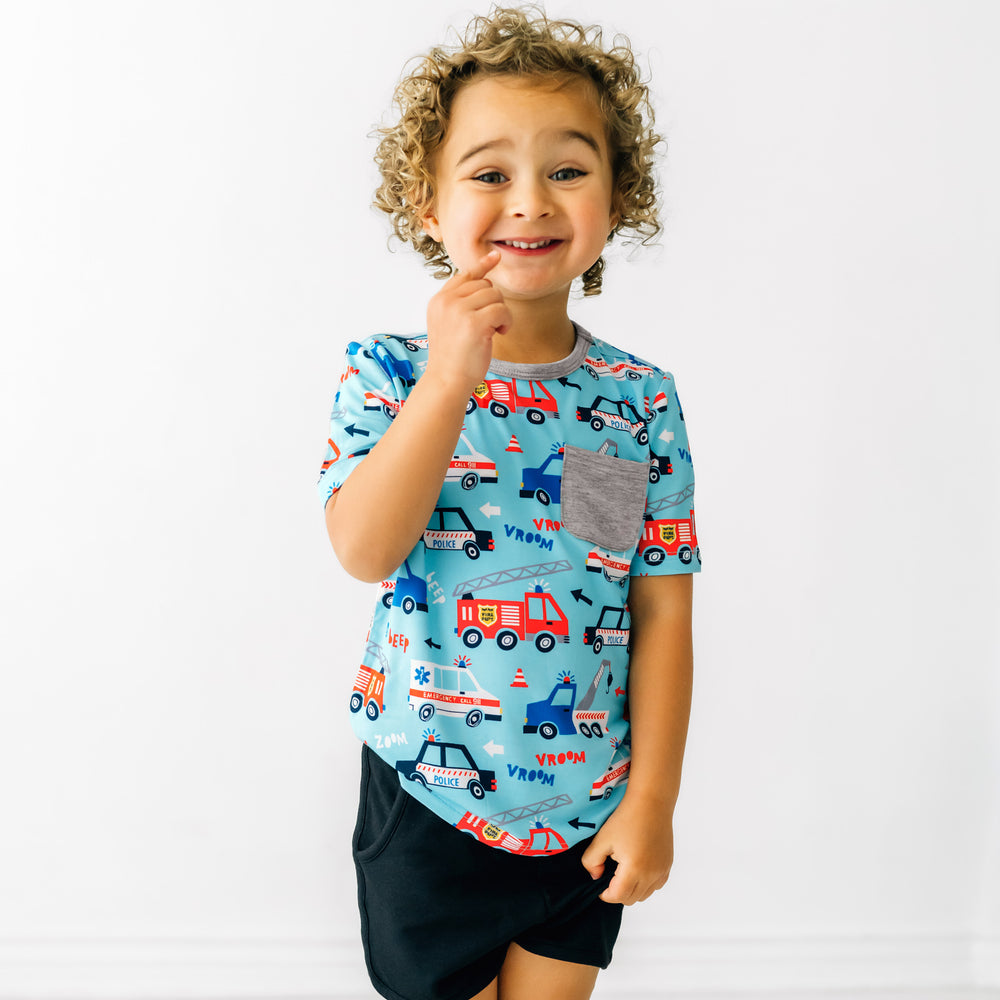 Child wearing a To The Rescue pocket tee paired with Black Shorts