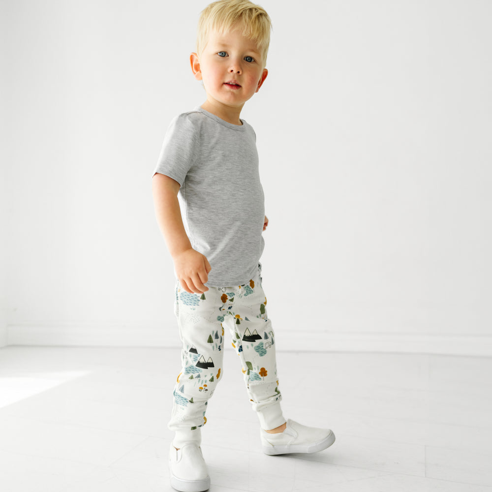 Child wearing Let's Explore joggers and coordinating Play tops