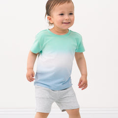Child wearing a Cool Ombre relaxed tee and coordinating shorts