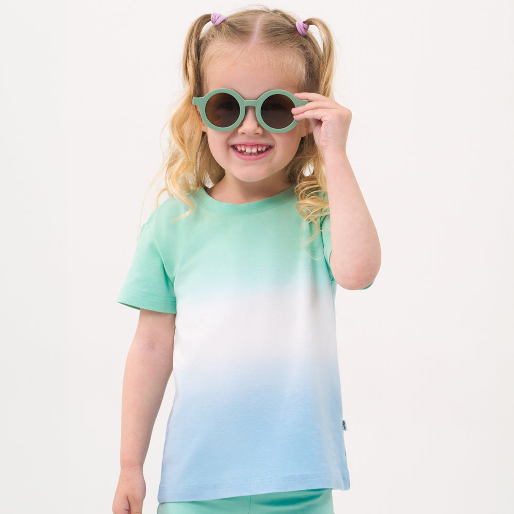 Close up image of a child wearing a Cool Ombre relaxed tee