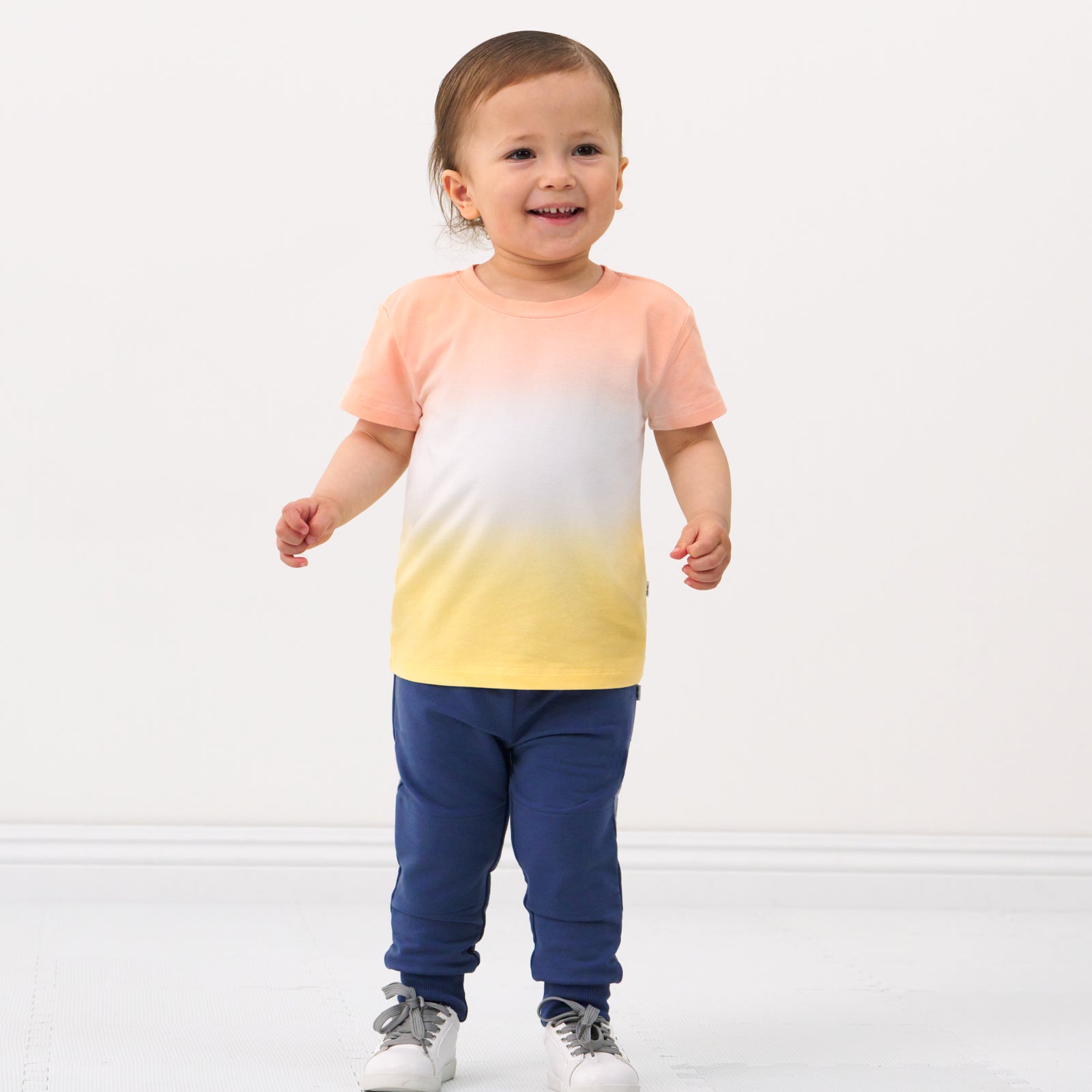 Child wearing a Sunny Ombre relaxed tee and coordinating joggers