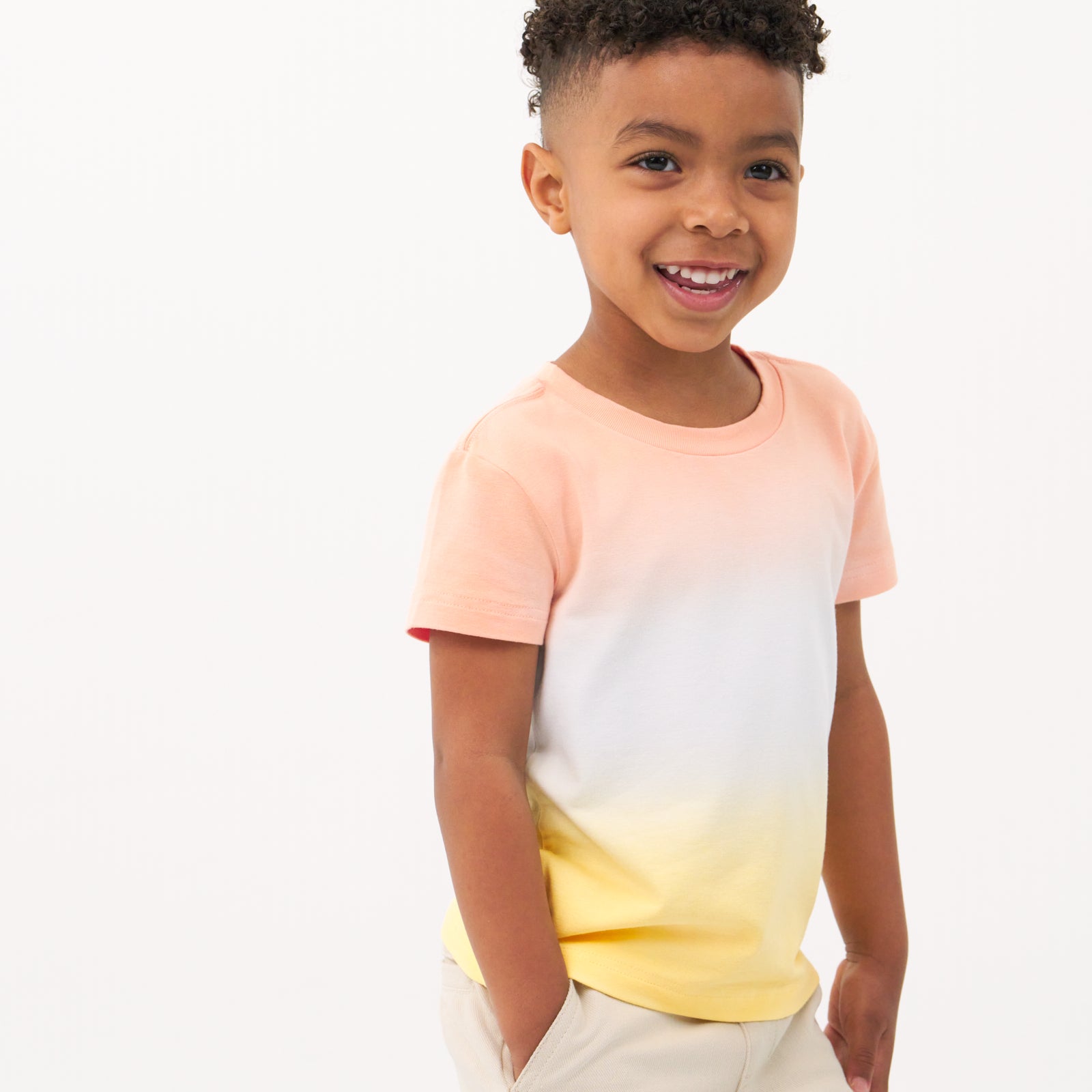 Close up image of a child wearing a Sunny Ombre relaxed tee