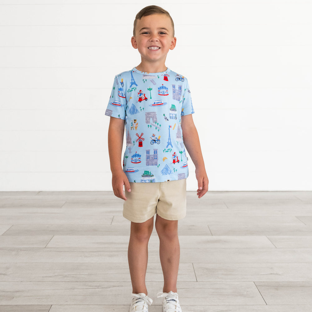 Boy smiling in the Blue Weekend in Paris Short Sleeve Tee and Light Khaki Chino Shorts