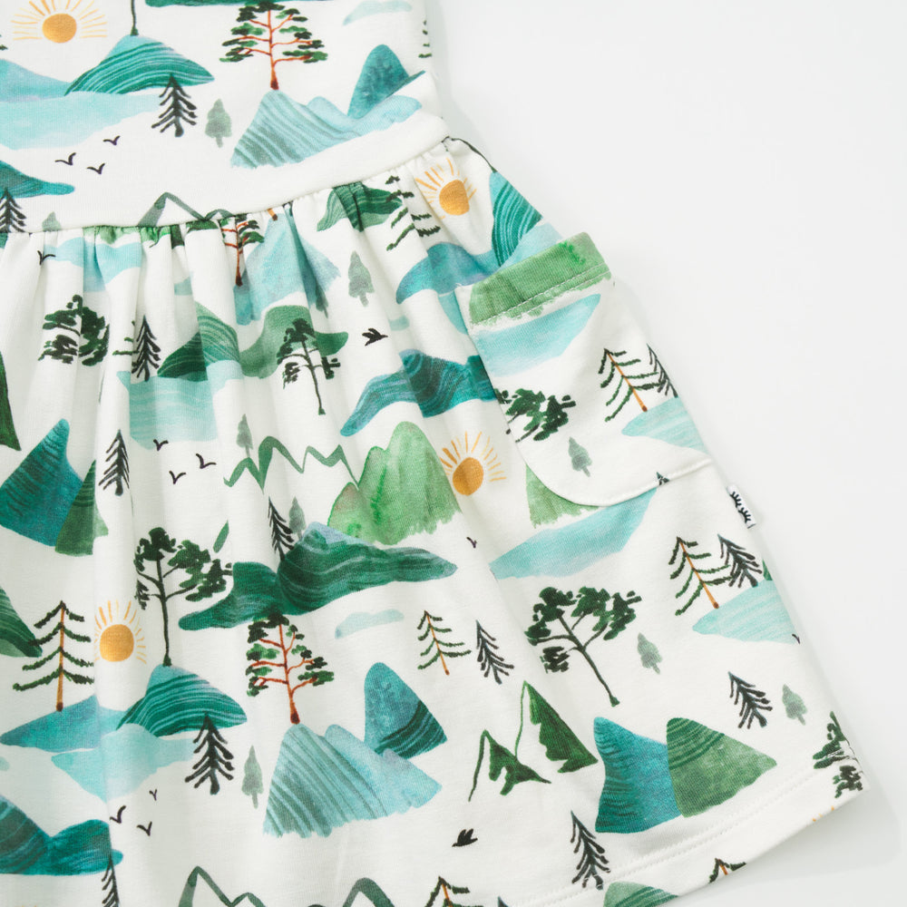 Close up detail shot of a Mountain Mist Patch Pocket Dress with Bloomer