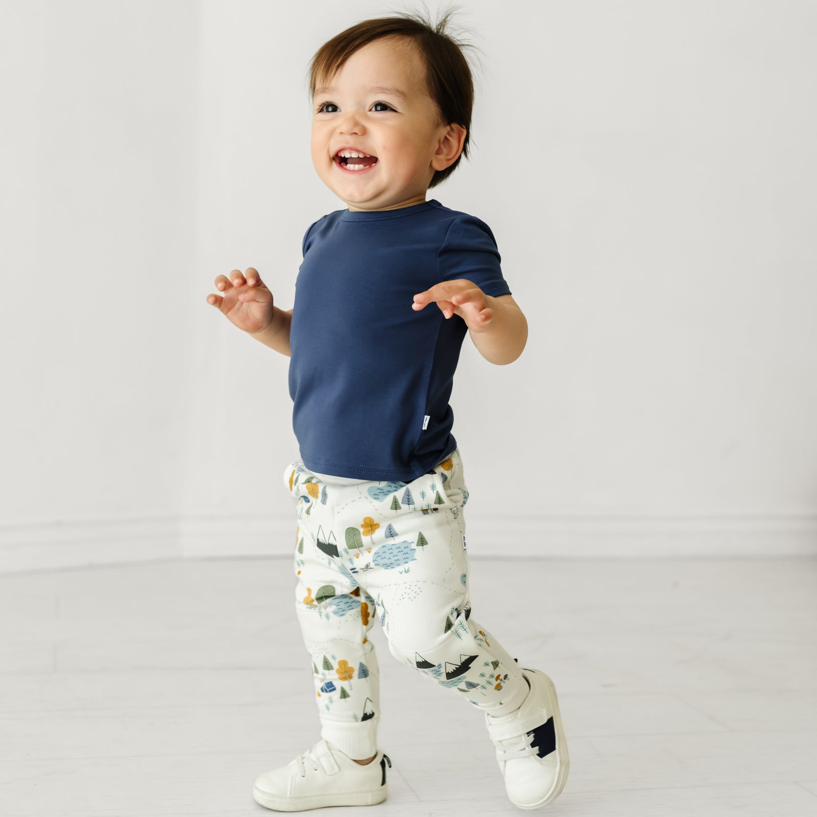 Child wearing a Vintage Navy classic tee and coordinating Play jogger