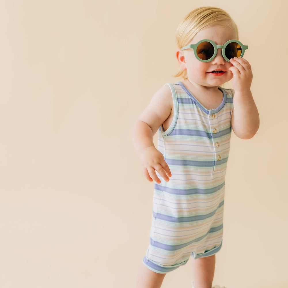 Alternate image of a child sitting wearing a Surf Stripe tank button romper