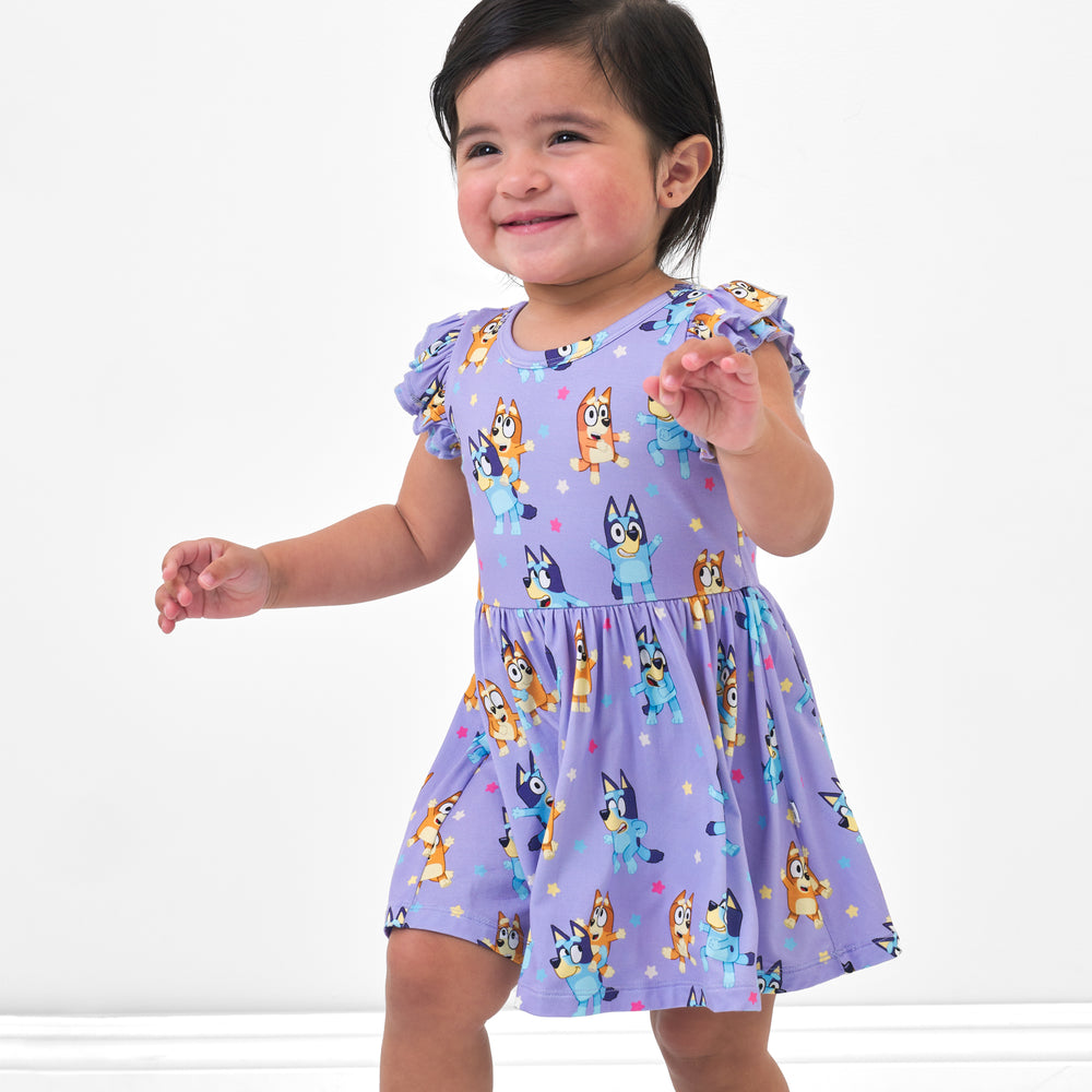 Child wearing a Bluey flutter twirl dress with bodysuit