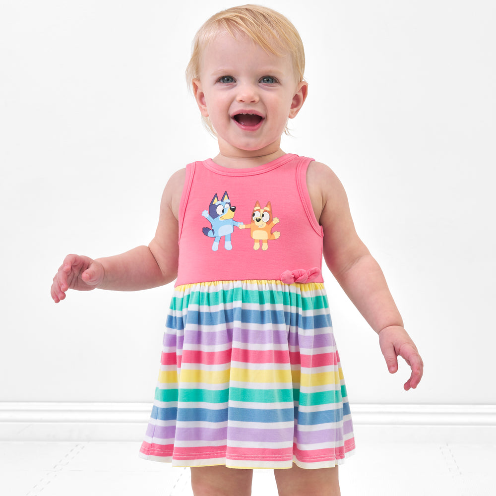 Child wearing a Bluey graphic skater dress with bodysuit