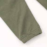 Close up flat lay image of the ankle detail on the Olive Denim Jogger