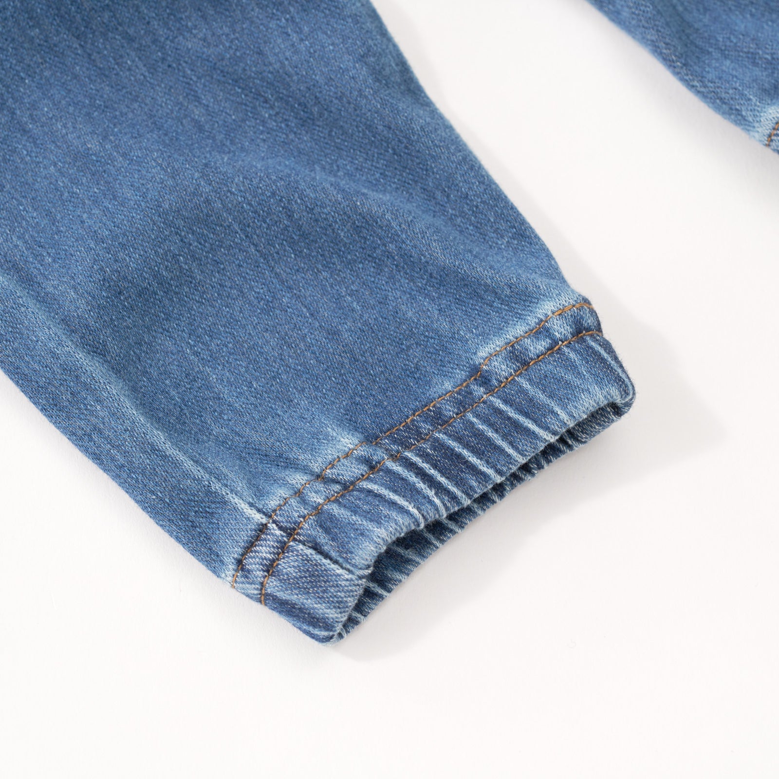 Close up image of the ankle detail on the Midwash Blue Denim Jogger