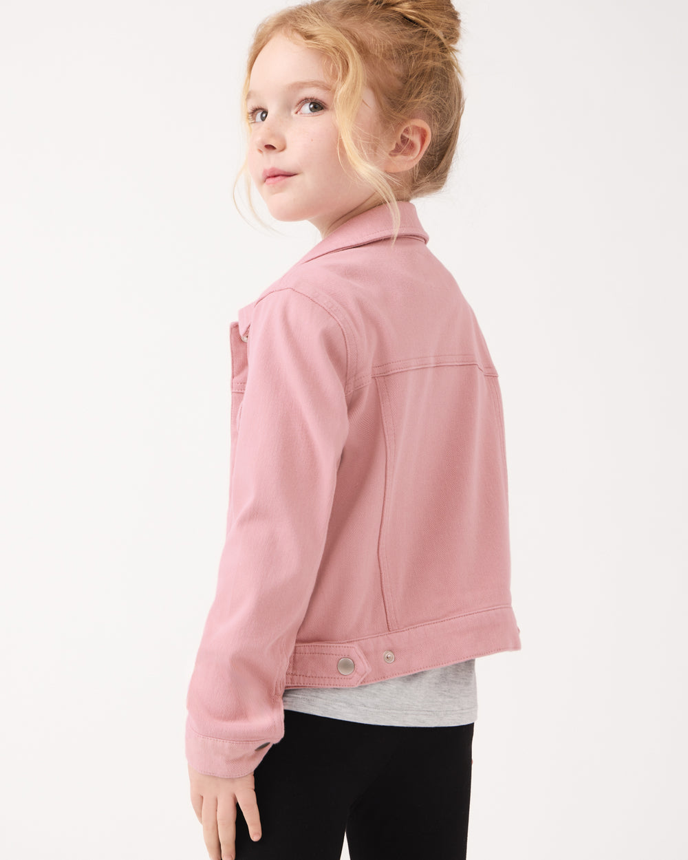 Back view of girl wearing the Mauve Blush Denim Trucker Jacket