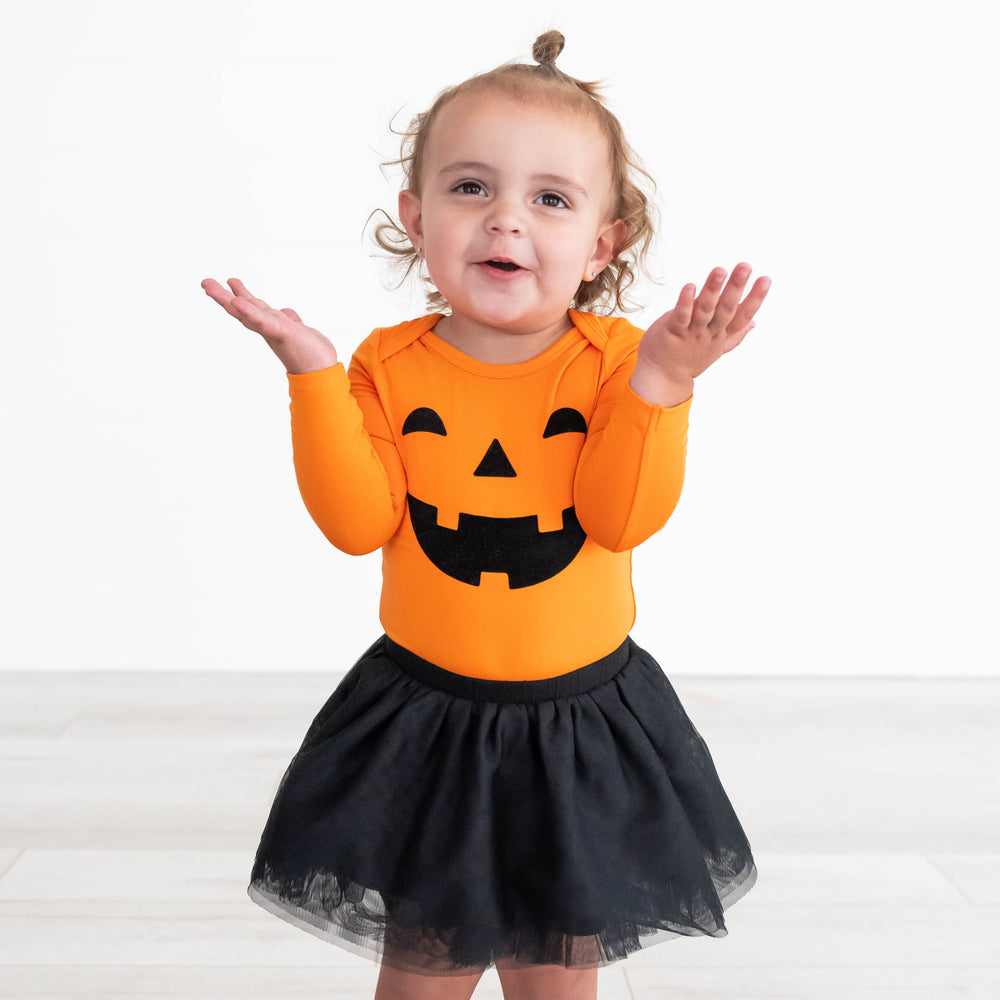 Girl posing in the Black Tutu Skirt and Pumpkin Onesie