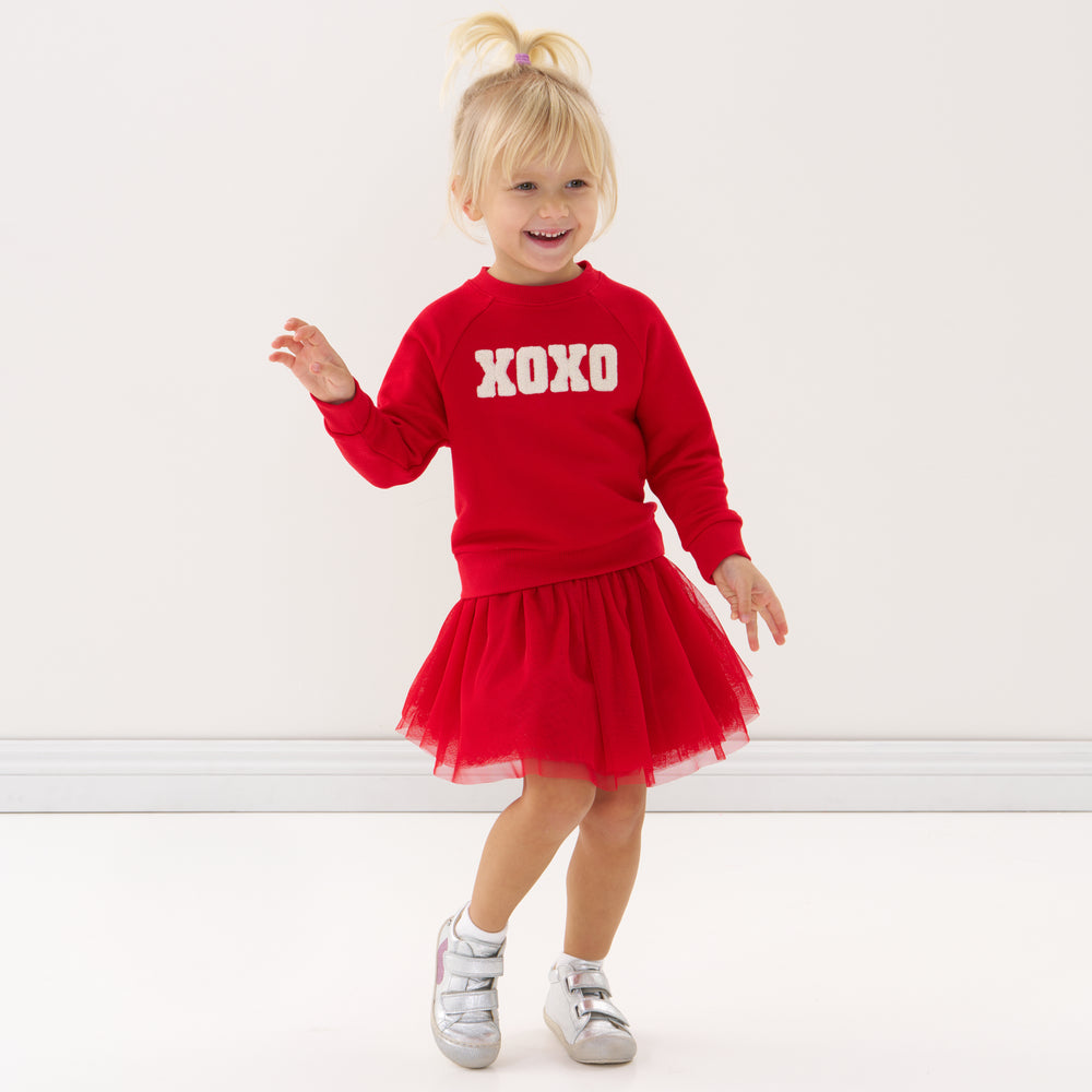 Click to see full screen - Child wearing a Candy Red tutu skirt and matching crewneck sweatshirt