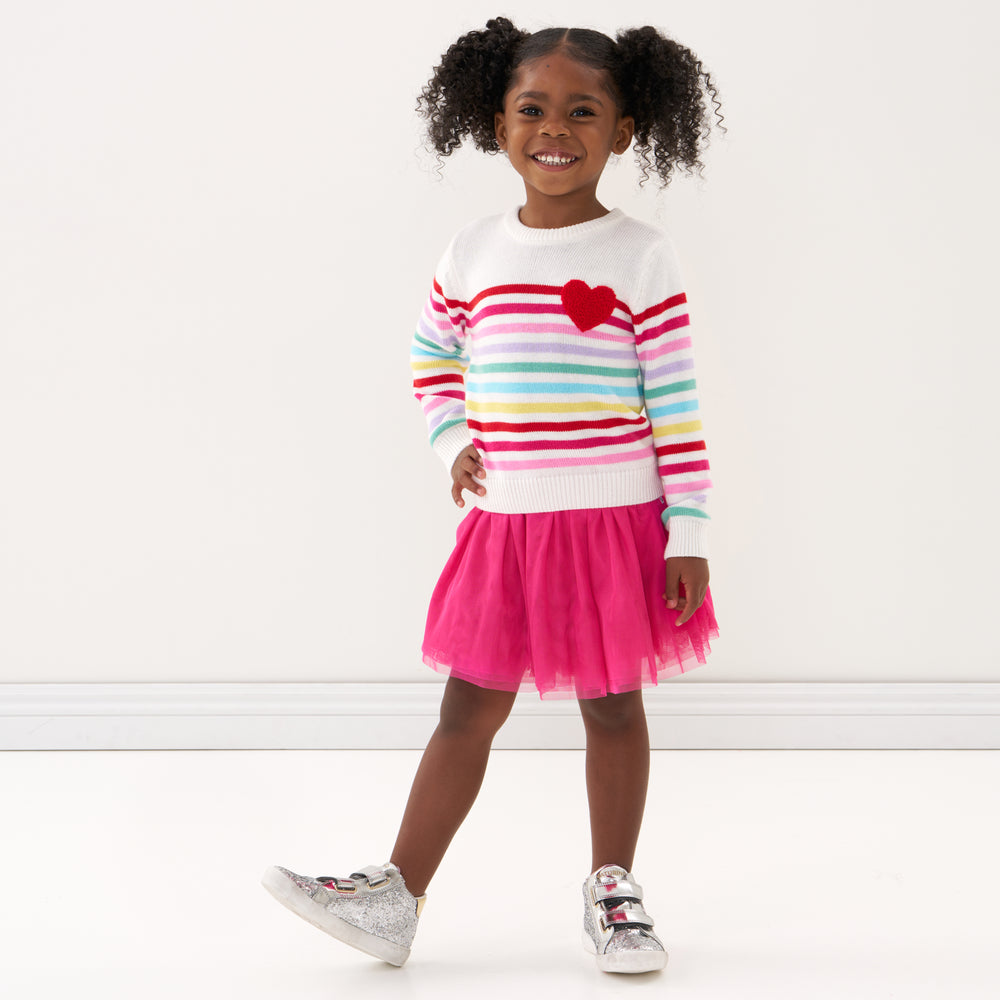 Click to see full screen - Child wearing a Pink Punch tutu skirt and coordinating knit sweater
