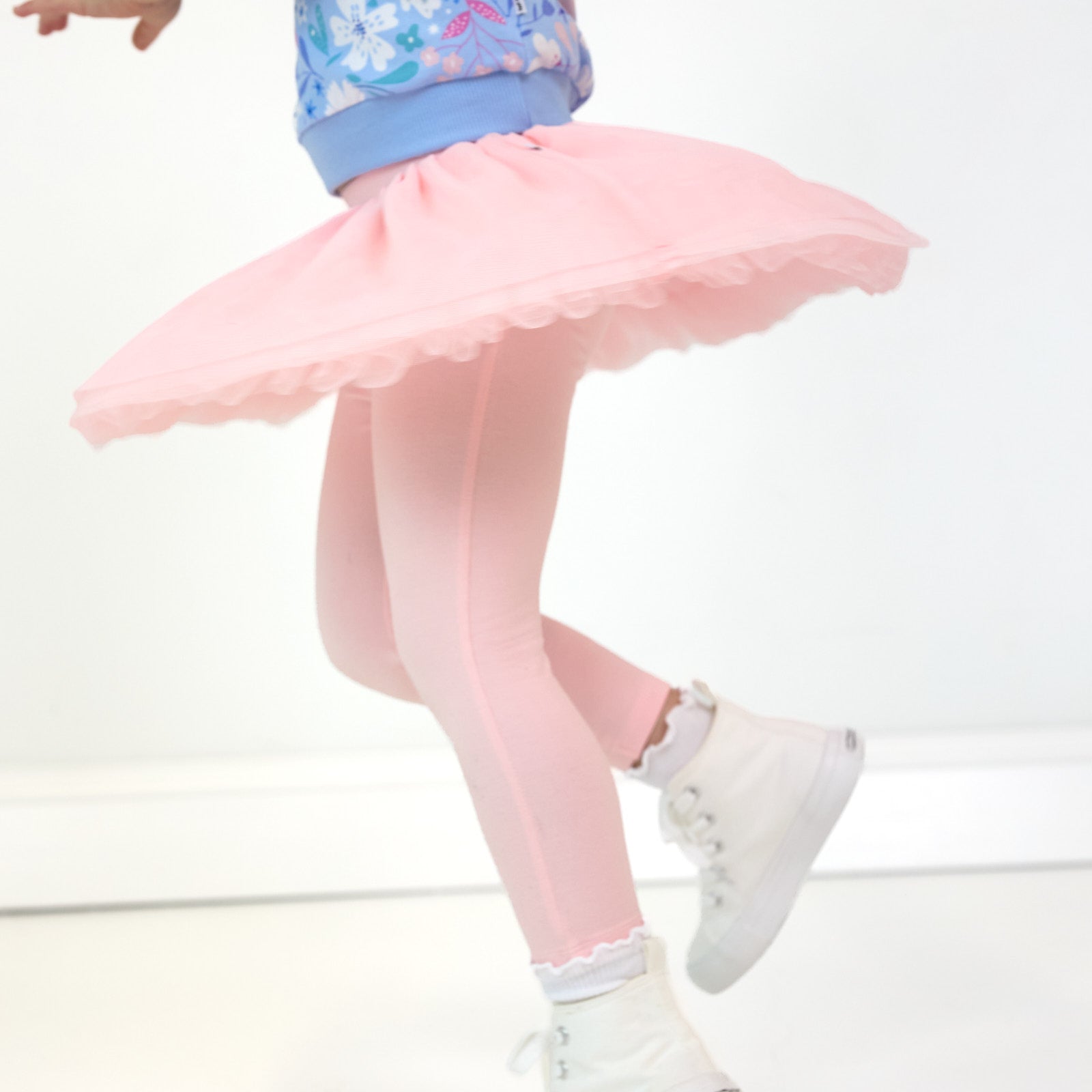 Close up image of girl twirling in the Prima Pink Tutu Legging