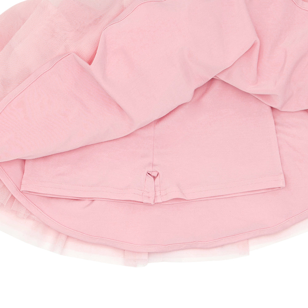 Click to see full screen - Close up flat lay image of a Pink Blossom tutu skort detailing the hidden shorts