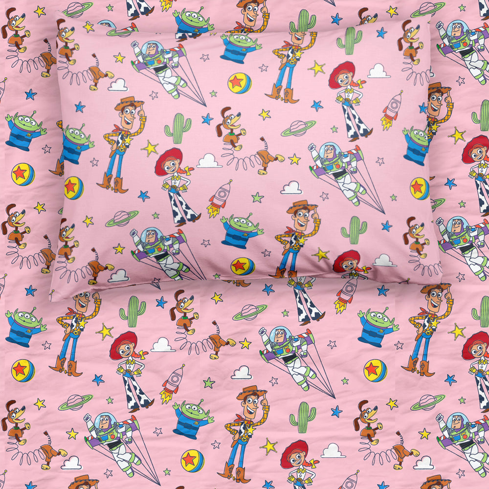 Flat lay image of a Pink Toy Story Stars twin sheet and matching pillowcase