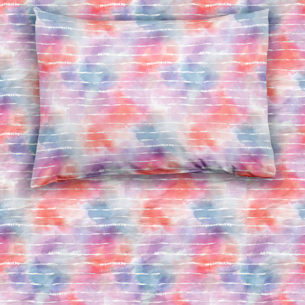 Pastel Tie Dye Dreams twin sheet set on a mattress and pillow
