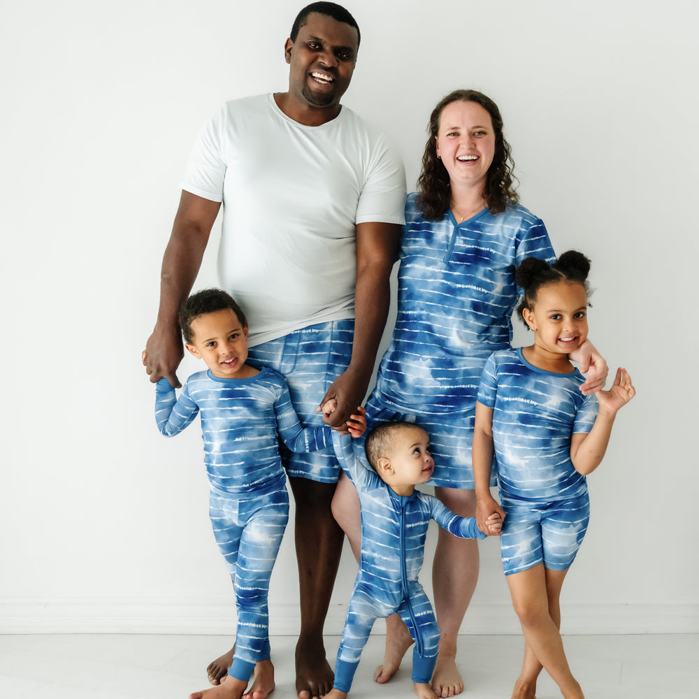 Family of five wearing matching Blue Tie Dye Dreams pajamas
