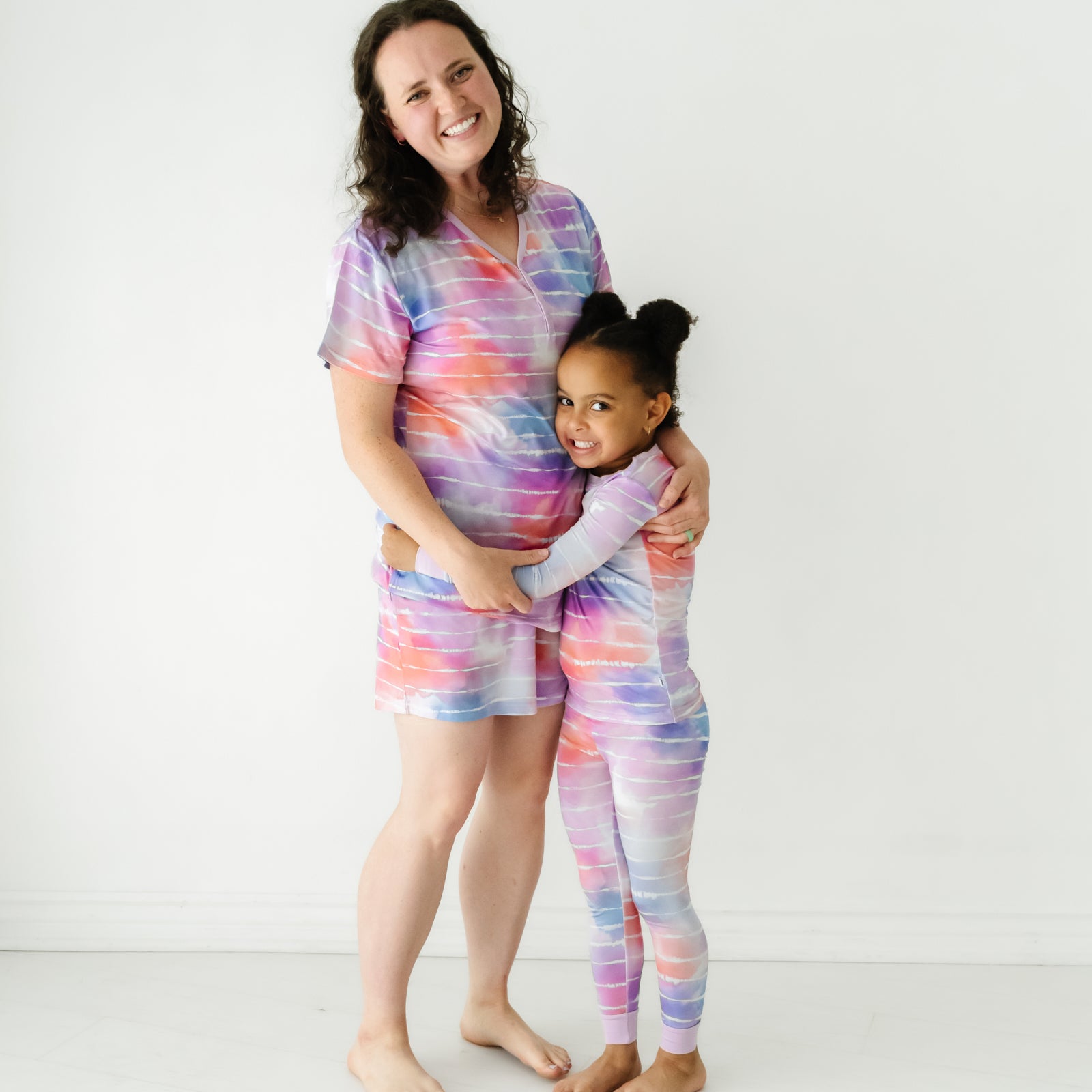 Mother and child wearing matching Pastel Tie Dye Dreams pajamas