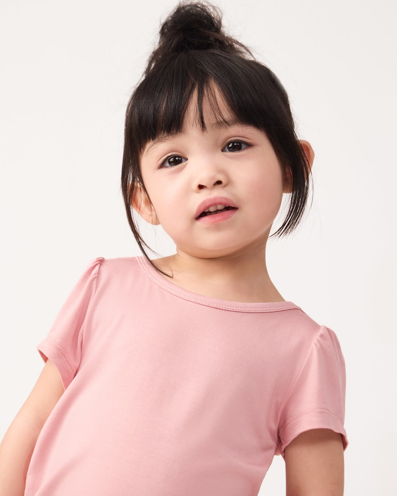 Close up of girl wearing the Mauve Blush Puff Sleeve Tee