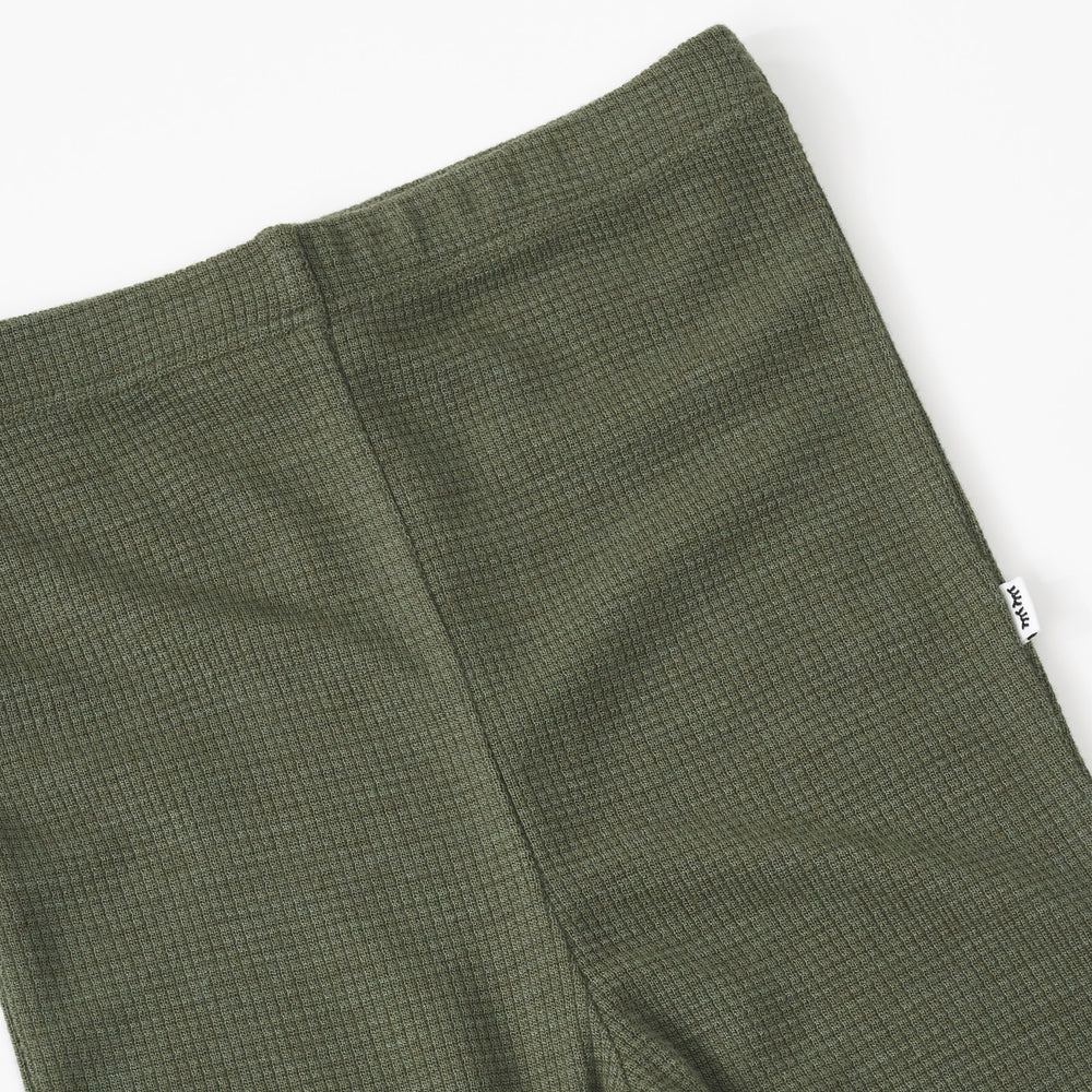 Close up detail shot of an Olive Waffle Flare Pant