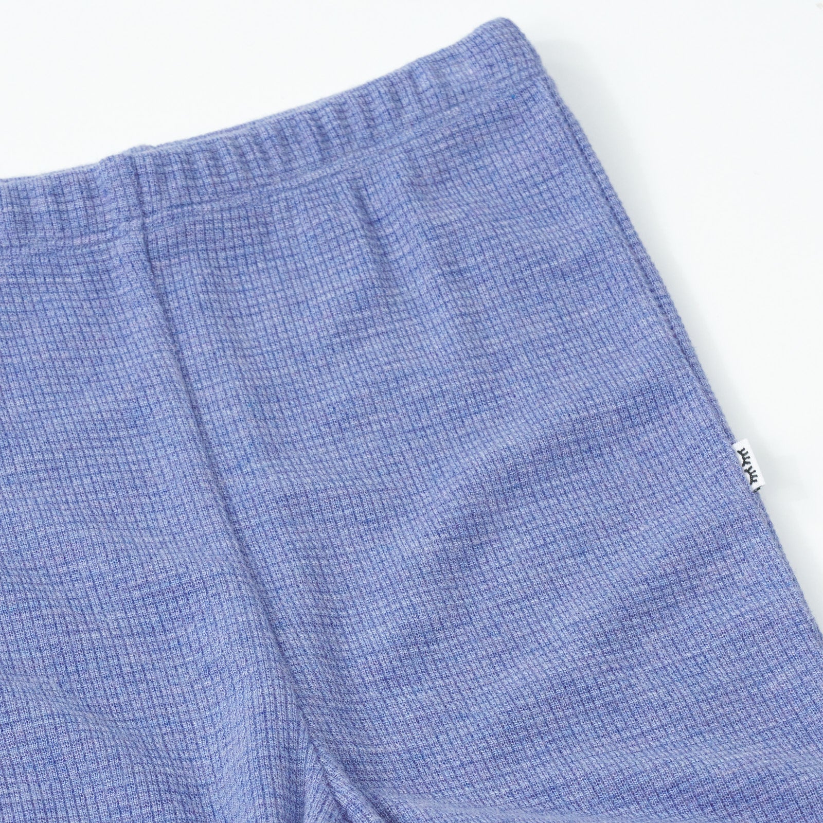 Close up detail shot of a Heather Lilac Waffle Flare Pant