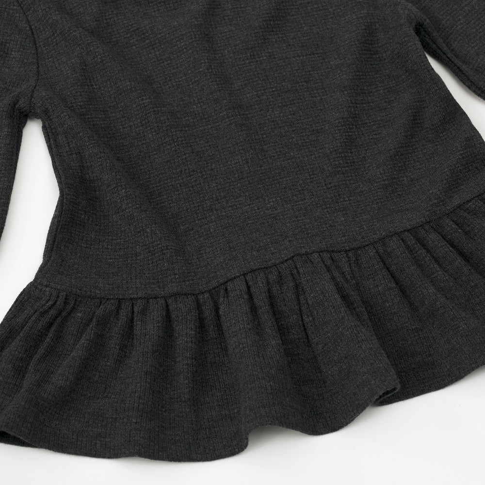 Alternate close up detail shot of a Heather Black Waffle Peplum Hooded Tee