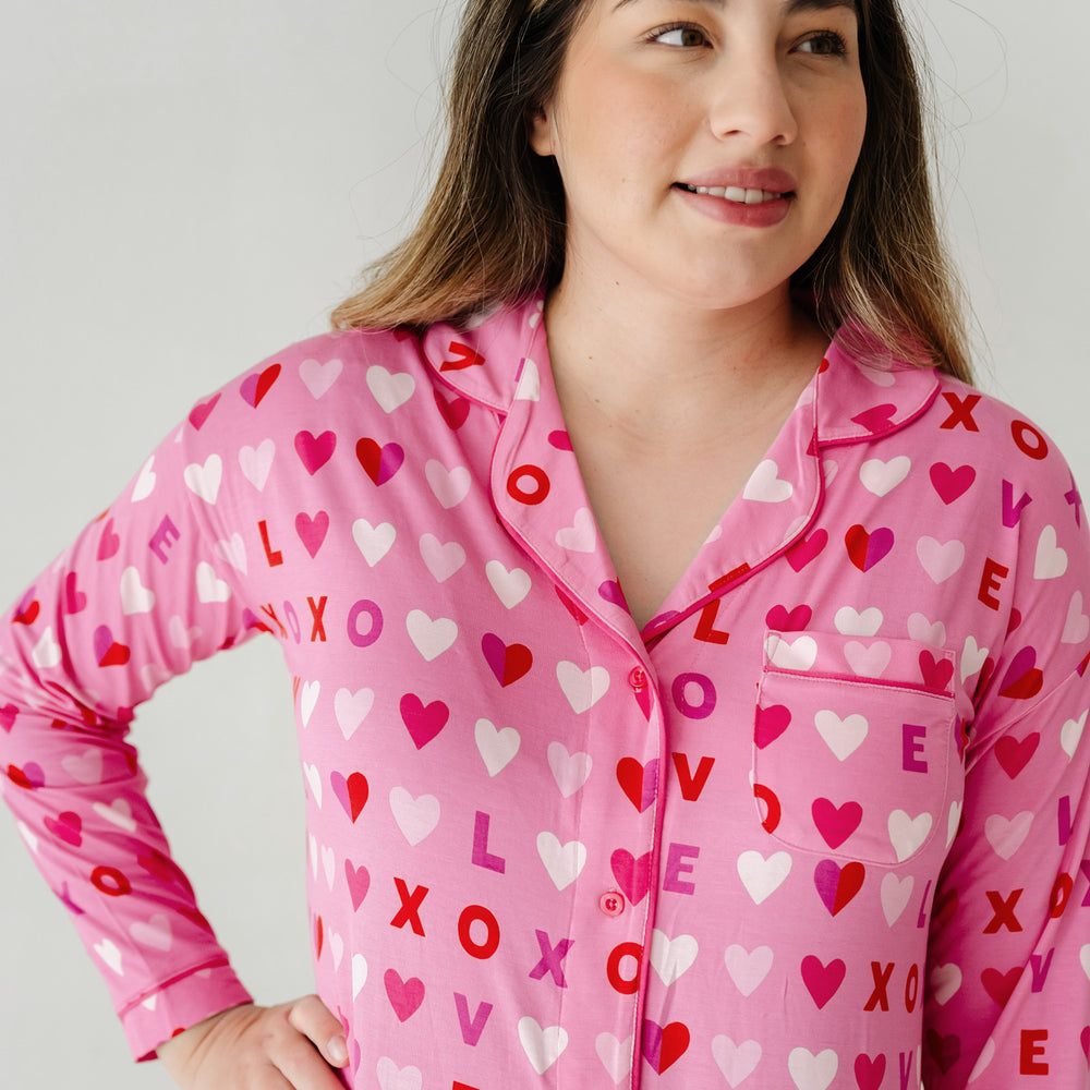 Click to see full screen - Close up image of a woman wearing a Pink XOXO women's sleep shirt