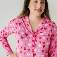 Close up image of a woman wearing a Pink XOXO women's sleep shirt