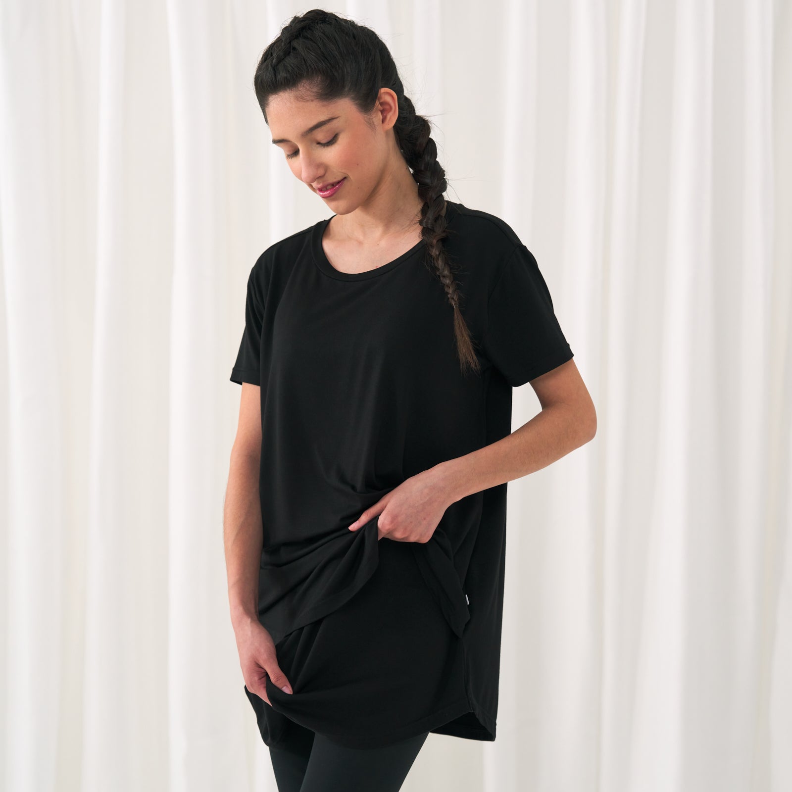 woman posing wearing a Black women's nursing top