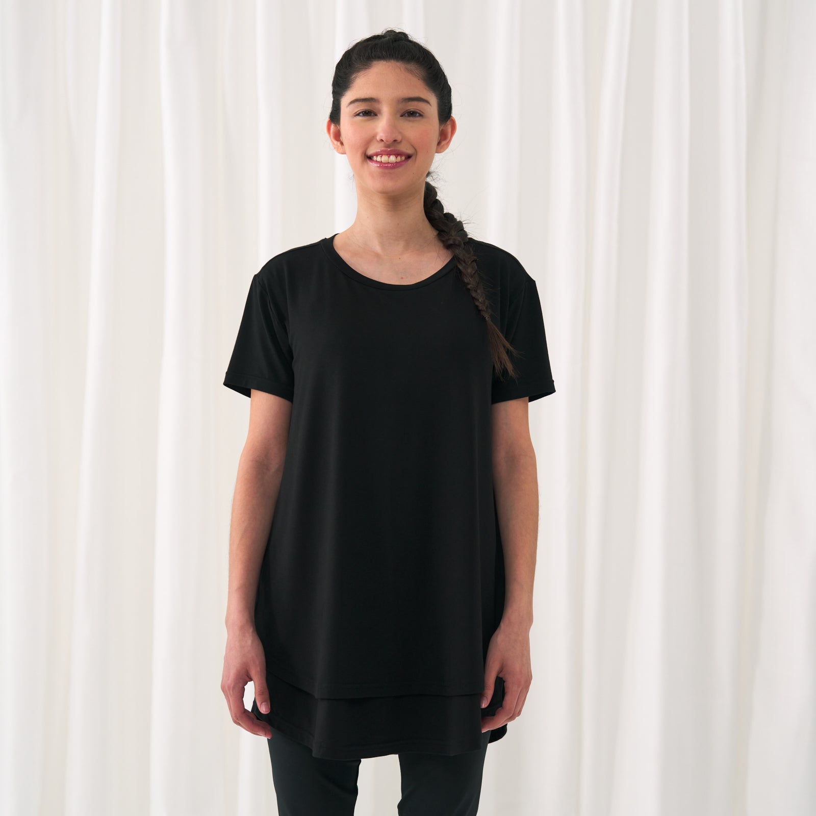 woman standing wearing a Black women's nursing top