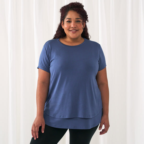woman standing wearing an Indigo women's nursing top