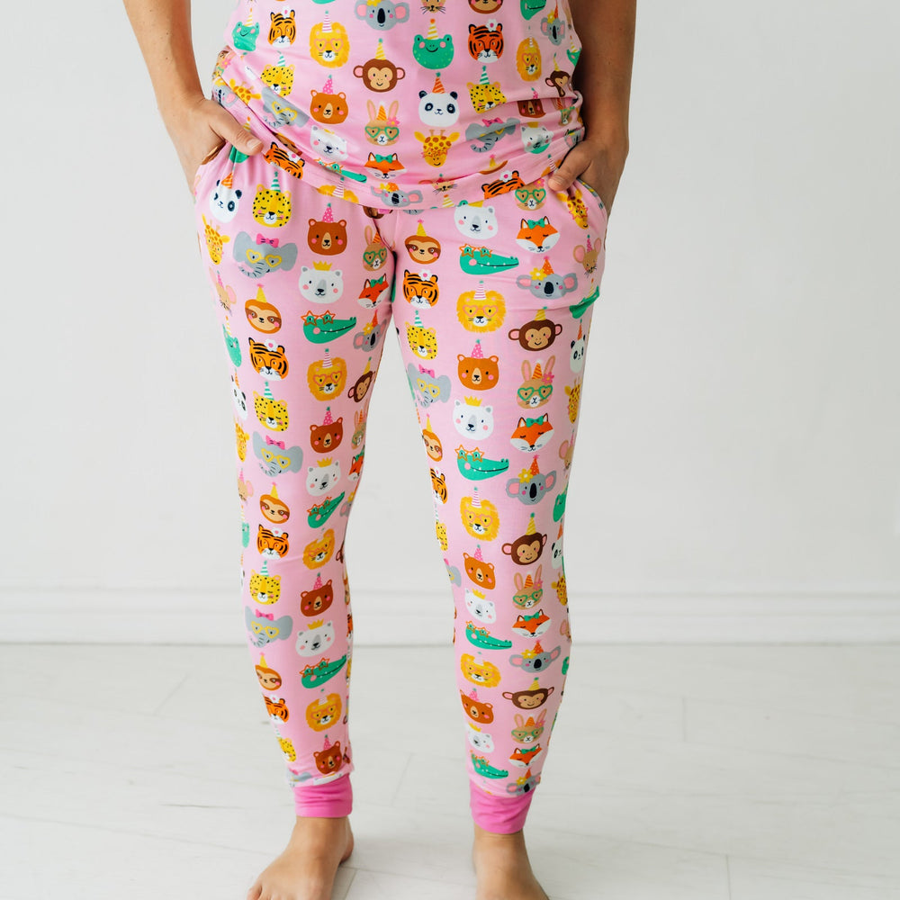 Close up image of a woman wearing Pink Party Pals women's pj pants