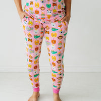 Close up image of a woman wearing Pink Party Pals women's pj pants