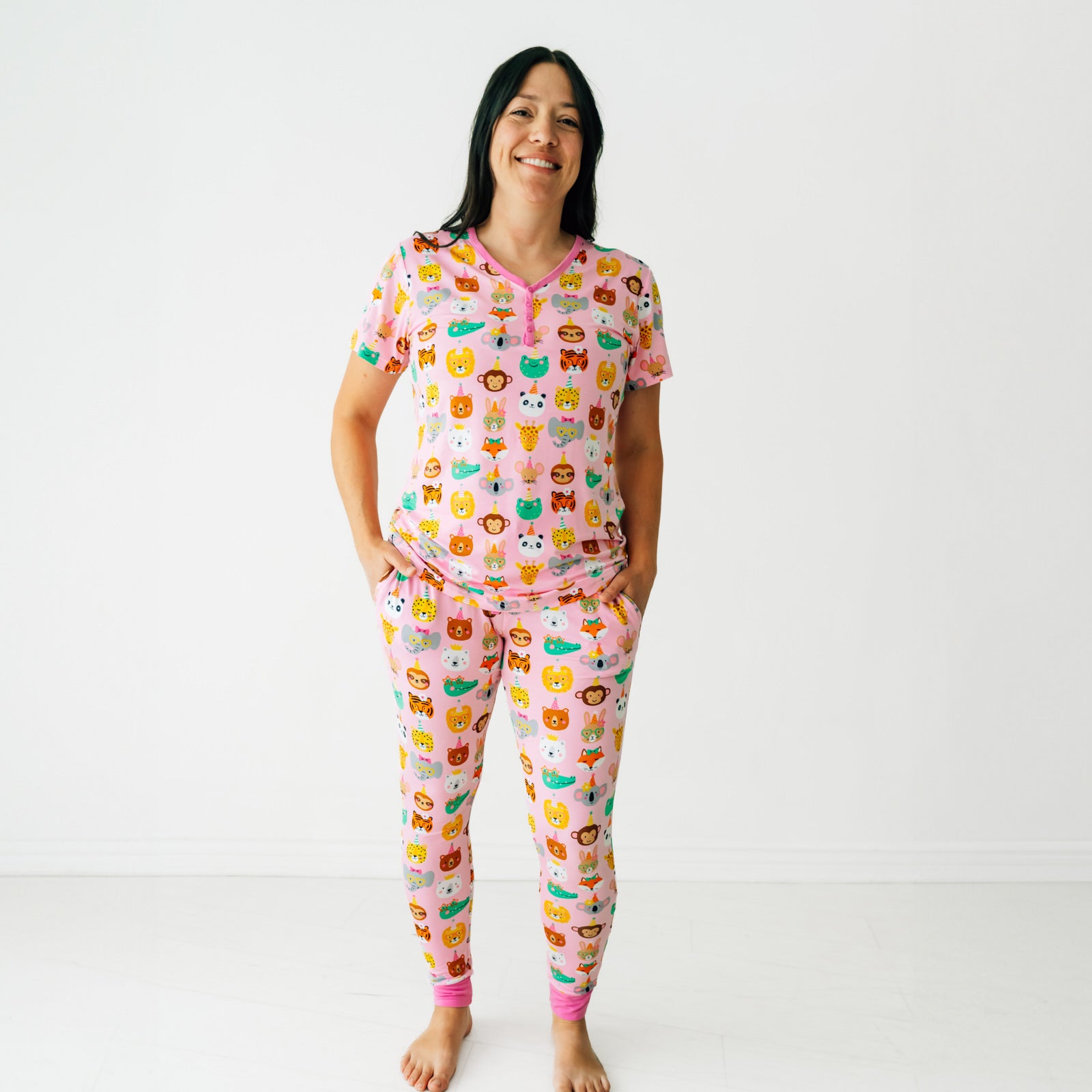 Woman wearing a Pink Party Pals women's pj top and matching women's pj pants