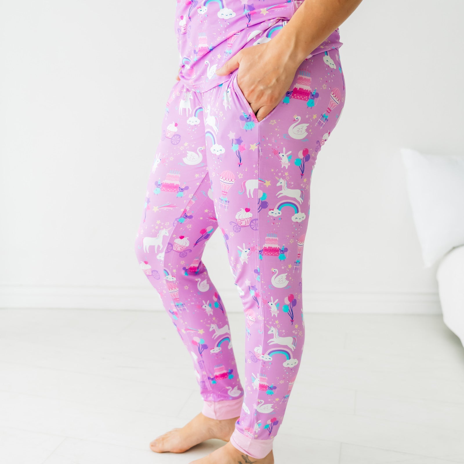 Close up profile image of a woman wearing Magical Birthday women's pj pants