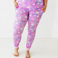 Close up image of a woman wearing Magical Birthday women's pj pants