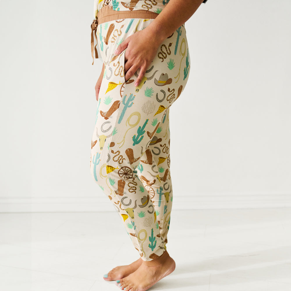 Close up profile image of a woman wearing Caramel Ready to Rodeo women's pajama pants