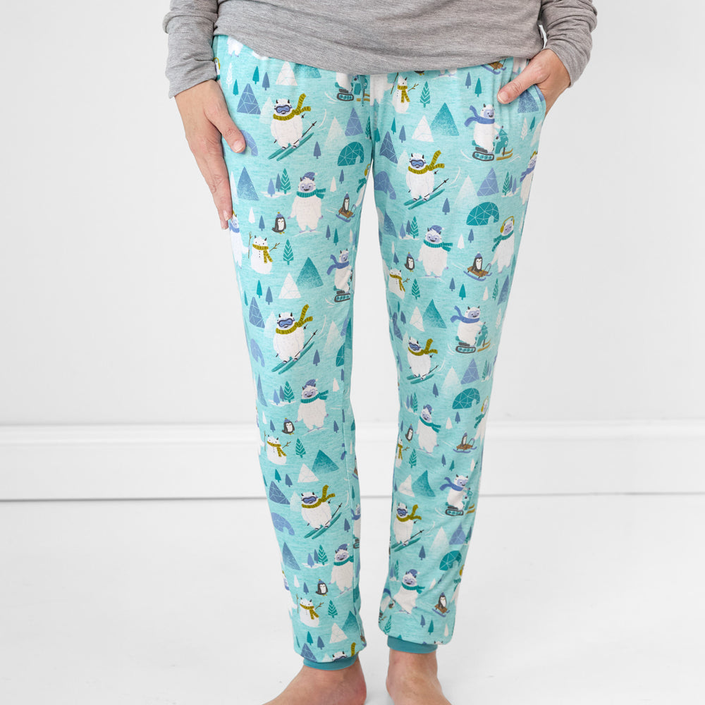 Close up image of a woman wearing women's Yeti Snow Day pj pants