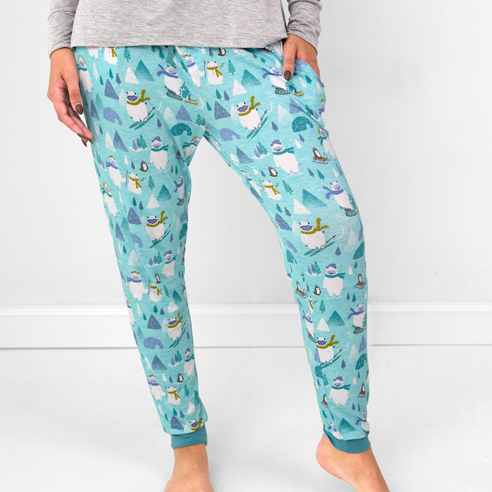 Close up image of a woman wearing Yeti Snow Day women's pj pants