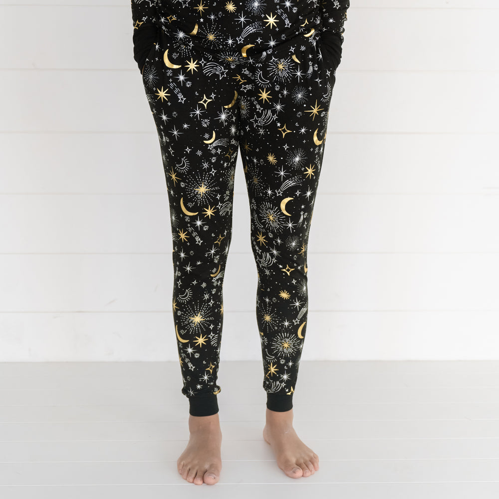 Close up image of a woman wearing Celebration Stars women's pj pants